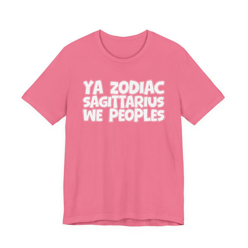 Pink t-shirt with white hand-lettered YA ZODIAC SAGITTARIUS WE PEOPLES print, front flat-lay view.