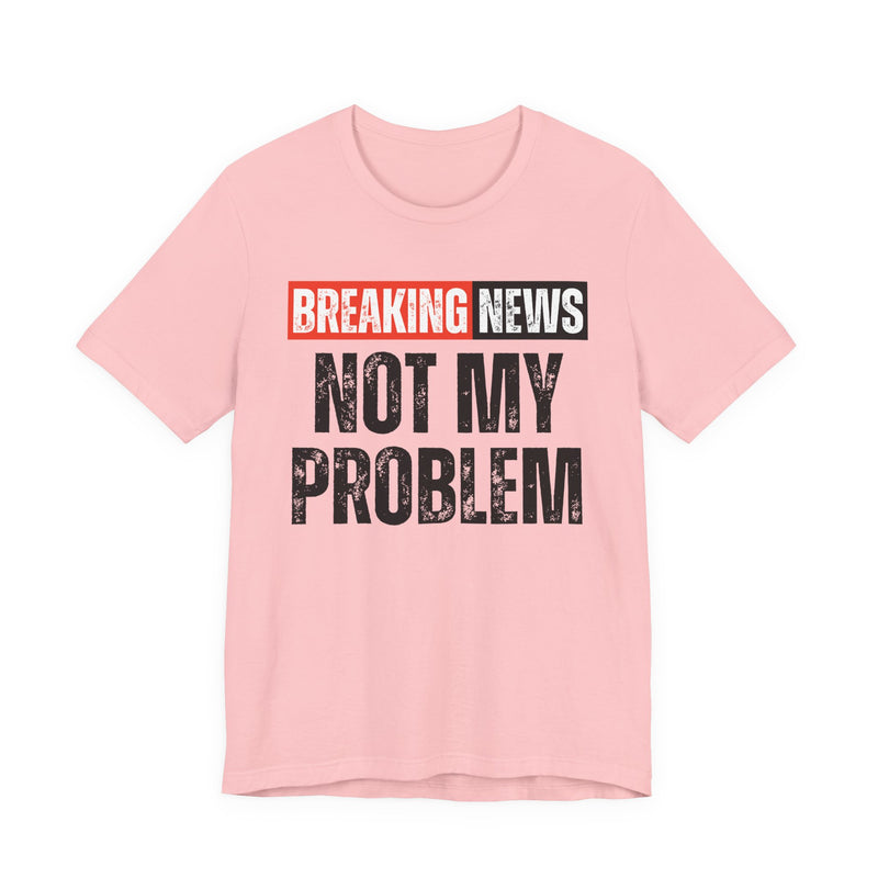 BREAKING NEWS: NOT MY PROBLEM distressed news-bar text design — t-shirt in Light Pink, front view, product mockup on white background