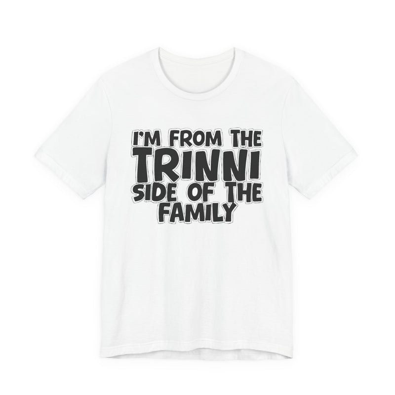 White t-shirt with 'I'M FROM THE TRINNI SIDE OF THE FAMILY' in black hand-drawn bubble lettering on the chest, front flat-lay mockup view.