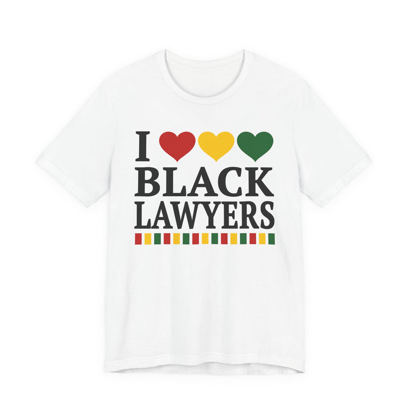 Front flat-lay of the I Love Black Lawyers t-shirt in White: black 'I' with red, gold, and green hearts above black 'BLACK LAWYERS' collegiate lettering, with a red, gold, and green stripe bar beneath the text.