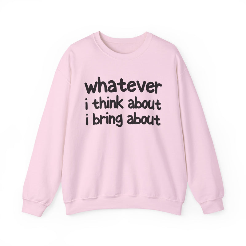 Natural sweatshirt with dark bold manifestation lettering reading WHATEVER I THINK ABOUT I BRING ABOUT, front flat-lay view.