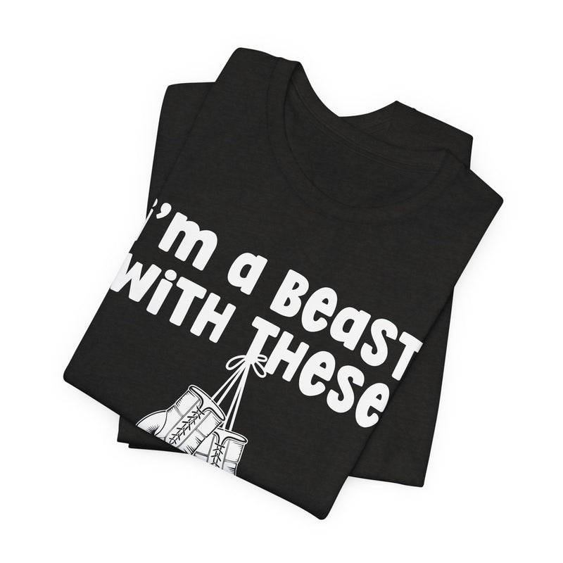 Black t-shirt with boxing gloves and cream collegiate lettering reading I'M A BEAST WITH THESE, flat-lay view.