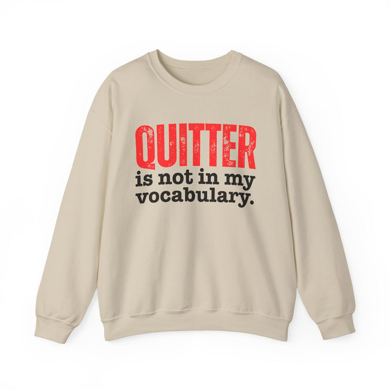 Graphic sweatshirt with bold statement lettering reading "QUITTER IS NOT IN MY VOCABULARY", front view, product mockup