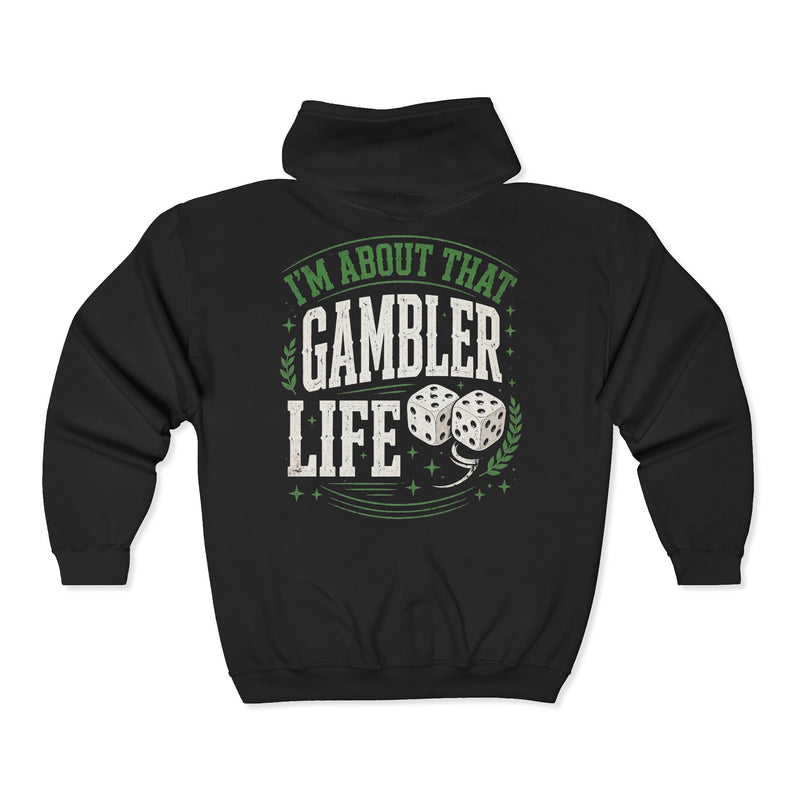 Black zip hoodie with white and green western lettering reading "I'M ABOUT THAT GAMBLER LIFE", back flat-lay view.