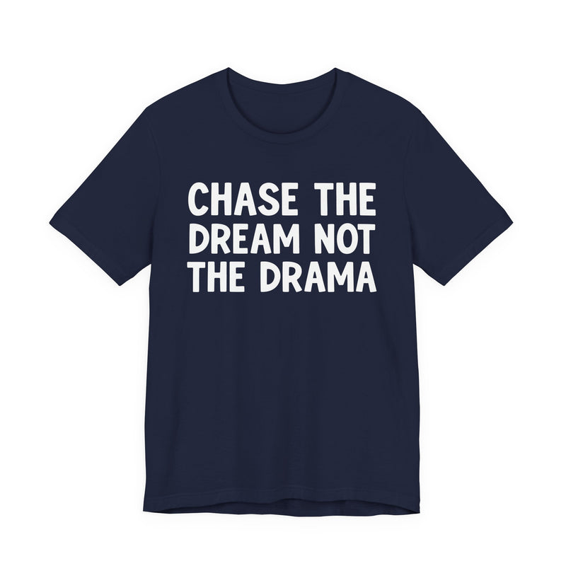Navy t-shirt with white bold statement lettering reading CHASE THE DREAM NOT THE DRAMA, front flat-lay view.