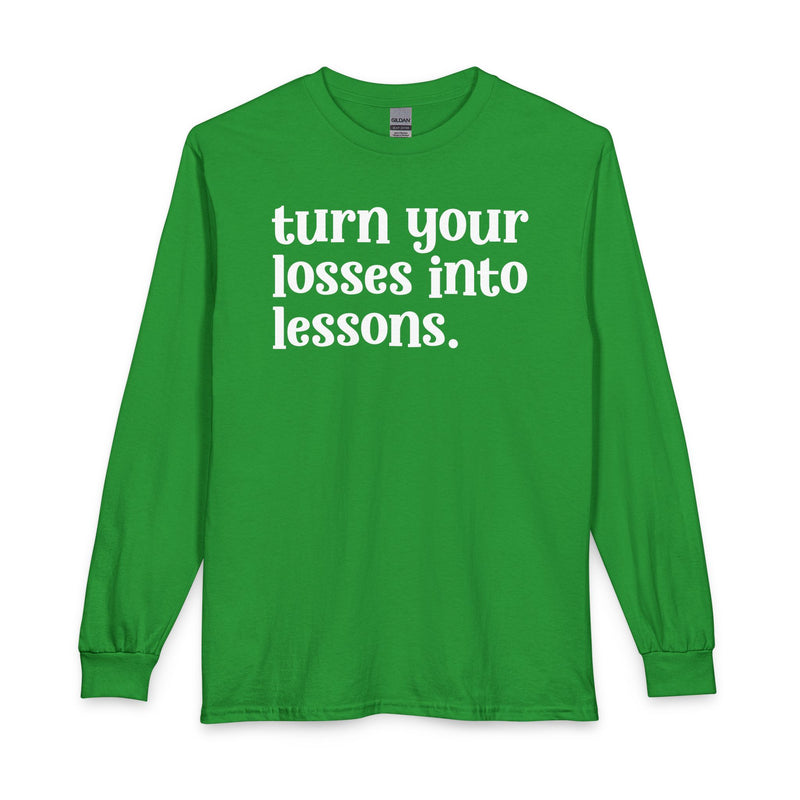 Irish green long sleeve t-shirt with white "turn your losses into lessons." lettering, front view.