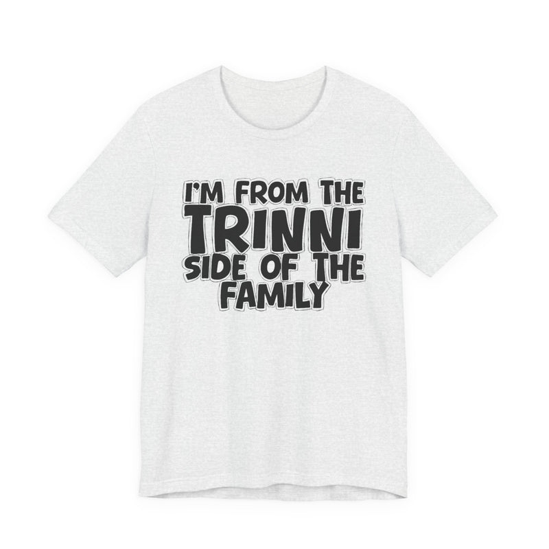 Soft Cream t-shirt with 'I'M FROM THE TRINNI SIDE OF THE FAMILY' in black hand-drawn bubble lettering on the chest, front flat-lay mockup view.