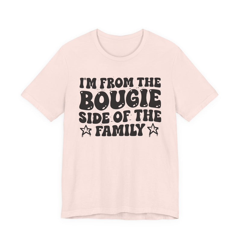 Soft Pink t-shirt with white outlined bubble lettering reading 'I'M FROM THE BOUGIE SIDE OF THE FAMILY', front flat-lay view.