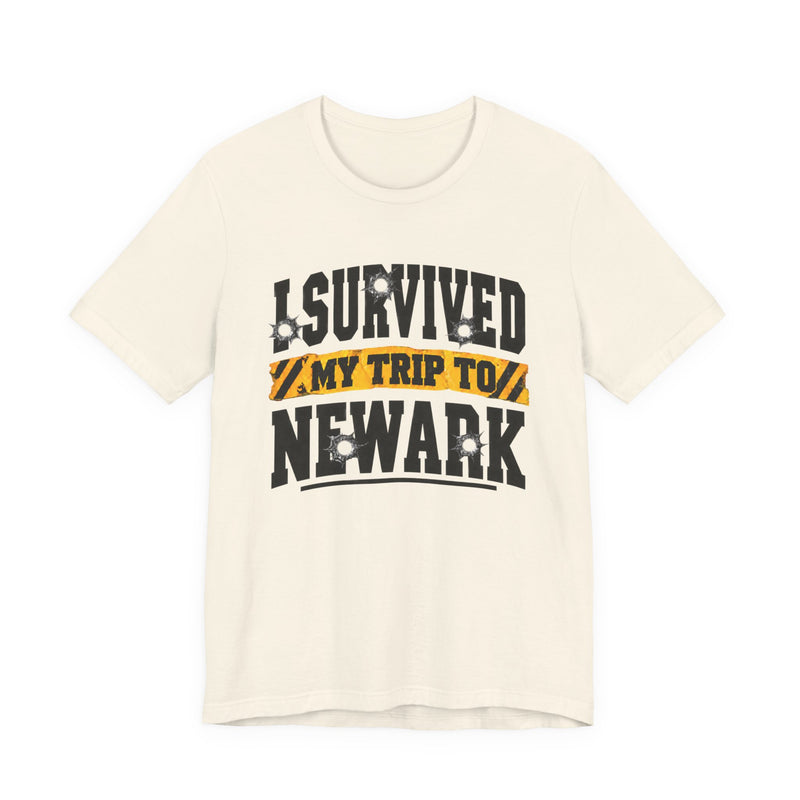 T-Shirt with collegiate lettering reading I SURVIVED MY TRIP TO NEWARK, front view.