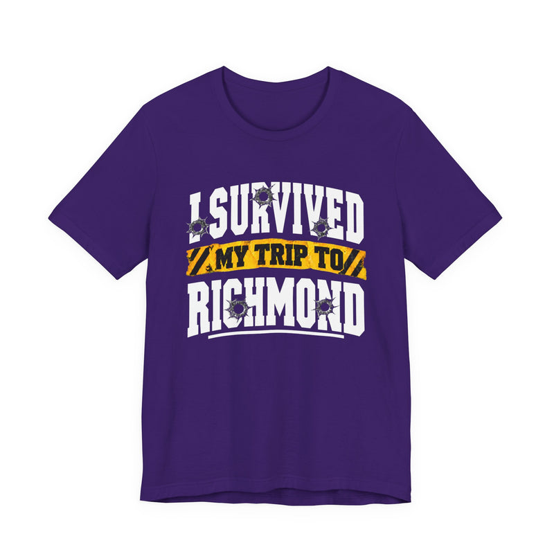 T-Shirt product photo with arched collegiate lettering reading "I SURVIVED" with bullet-hole decals, a caution-tape band reading "MY TRIP TO", and large block letters reading "RICHMOND", front view.