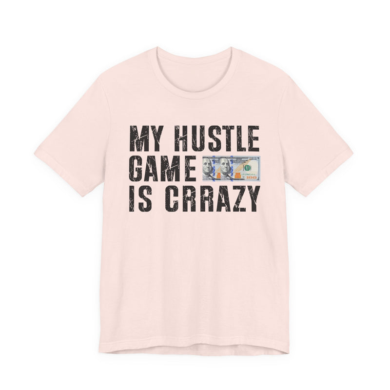 White t-shirt with dark bold grind lettering reading MY HUSTLE GAME IS CRAZY, front flat-lay view.