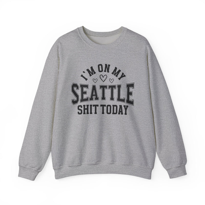 Sweatshirt product with collegiate lettering with heart accents reading I'M ON MY SEATTLE SHIT TODAY, detail close-up.