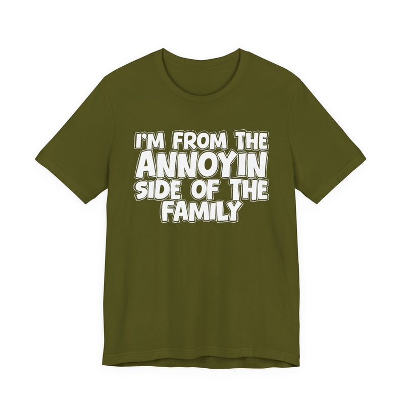 dark t-shirt with ‘I’M FROM THE ANNOYIN SIDE OF THE FAMILY’ statement text in bold outline lettering, front flat-lay view.