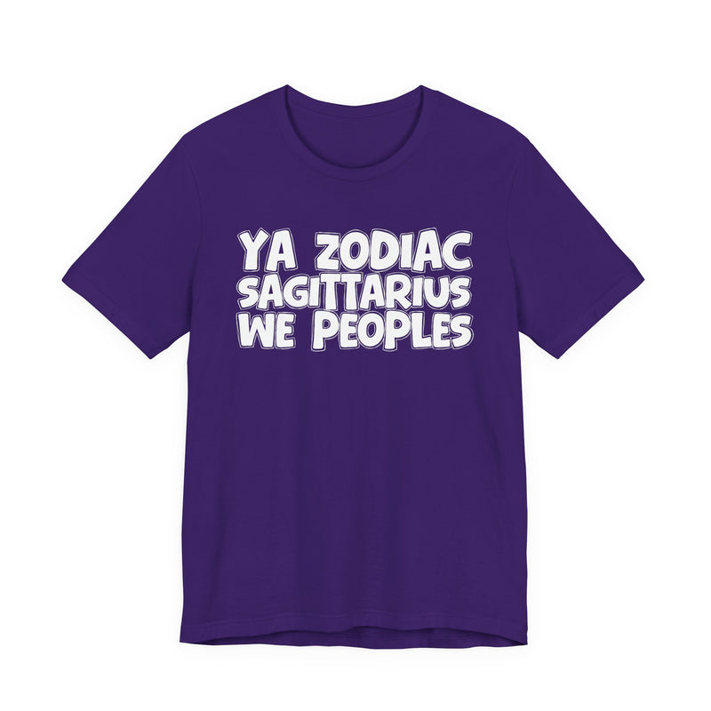 Purple t-shirt with white hand-lettered YA ZODIAC SAGITTARIUS WE PEOPLES print, front flat-lay view.