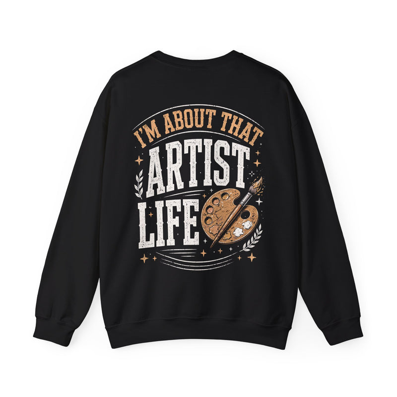 Black sweatshirt with white and gold western lettering reading "I'M ABOUT THAT ARTIST LIFE", back flat-lay view.