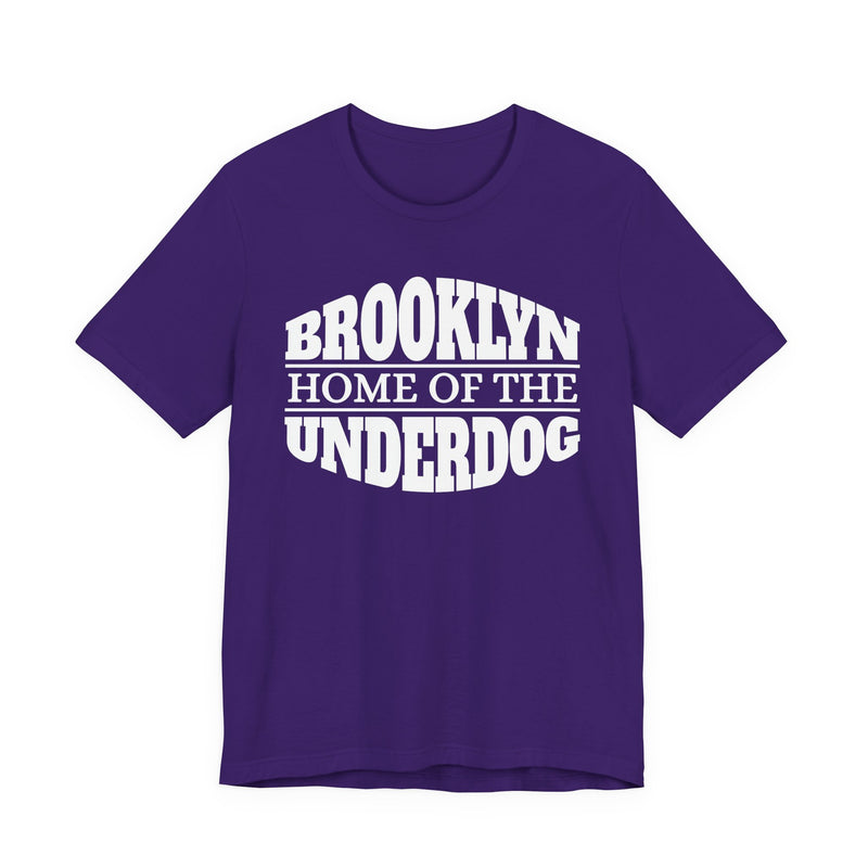 T-shirt with bold lettering reading BROOKLYN (HOME OF THE) UNDERDOG, product view.