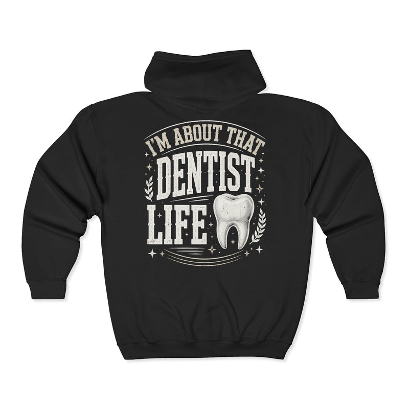 Black zip hoodie with white bubble lettering reading I'M ABOUT THAT DENTIST LIFE, back view.