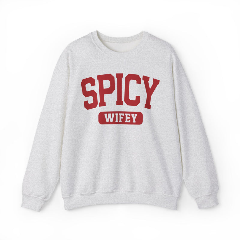 Natural sweatshirt with contrasting statement lettering reading SPICY WIFEY, front flat-lay view.