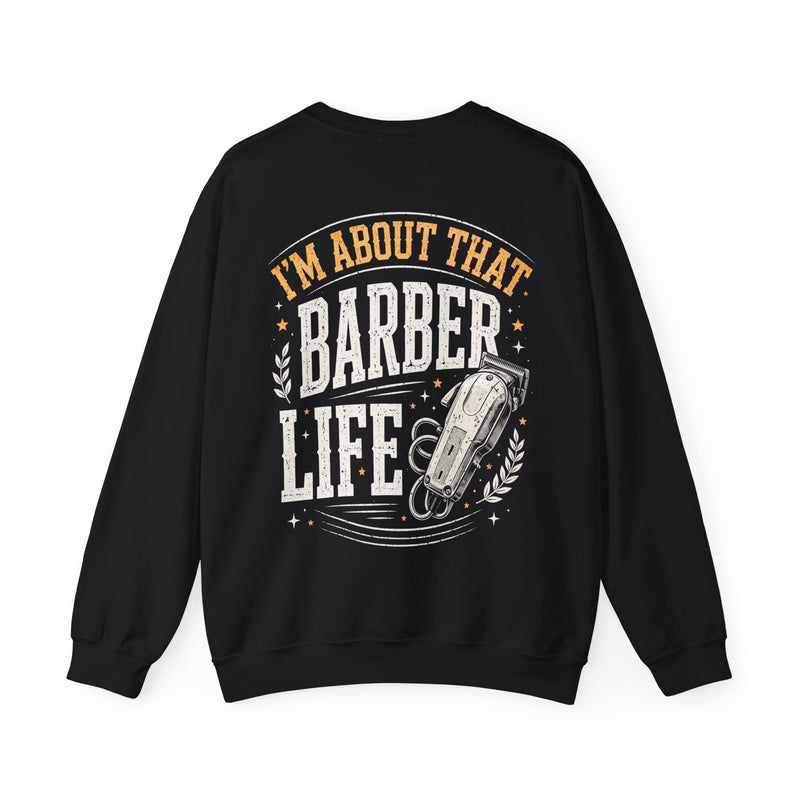 Black sweatshirt with white and orange distressed trade lettering reading I'M ABOUT THAT BARBER LIFE, back view.