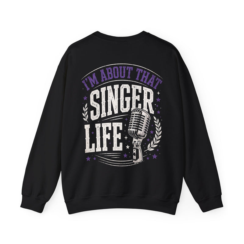 Black sweatshirt with purple and white bubble lettering reading I'M ABOUT THAT SINGER LIFE, front view.