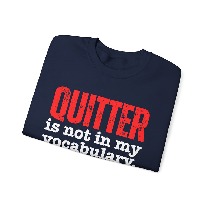 Graphic sweatshirt with bold statement lettering reading "QUITTER IS NOT IN MY VOCABULARY", front view, product mockup