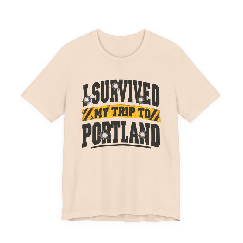 T-Shirt with collegiate lettering reading I SURVIVED MY TRIP TO PORTLAND, front view.