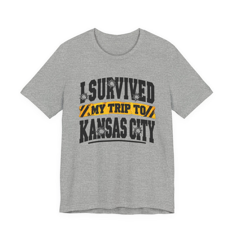 T-Shirt product with collegiate lettering reading I SURVIVED MY TRIP TO KANSAS CITY, lifestyle view.