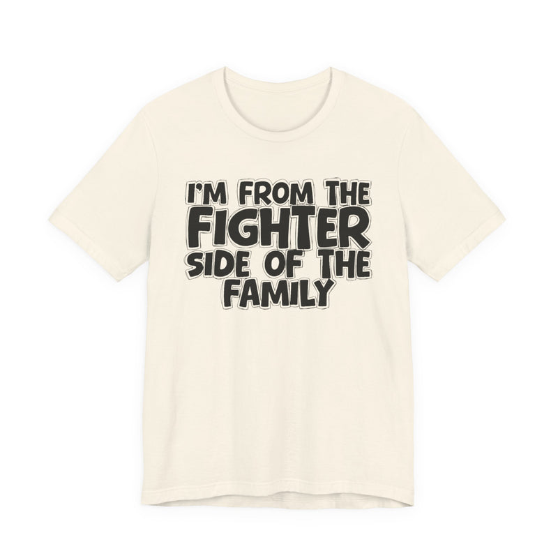 light t-shirt with ‘I’M FROM THE FIGHTER SIDE OF THE FAMILY’ statement text in bold outline lettering, front flat-lay view.