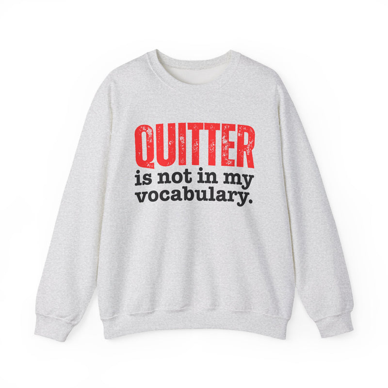 Graphic sweatshirt with bold statement lettering reading "QUITTER IS NOT IN MY VOCABULARY", front view, product mockup