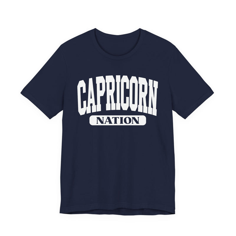 Navy t-shirt with white arched CAPRICORN lettering and a NATION pill badge, front view.