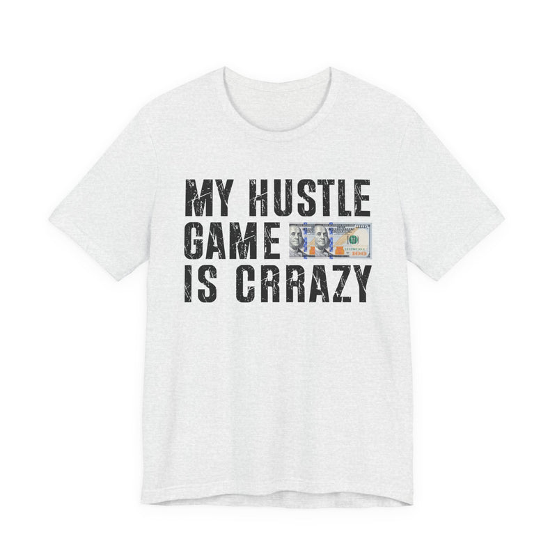 White t-shirt with dark bold grind lettering reading MY HUSTLE GAME IS CRAZY, front flat-lay view.