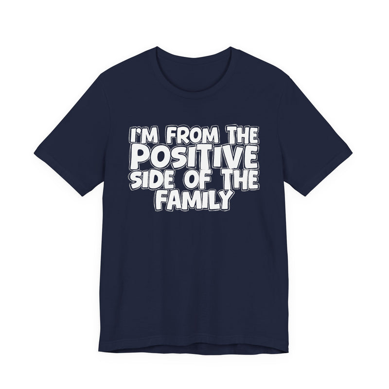 Navy t-shirt with white outlined bubble lettering reading 'I'M FROM THE POSITIVE SIDE OF THE FAMILY', front flat-lay view.