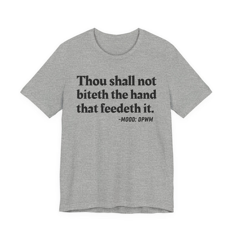 T-Shirt with text design reading “THOU SHALL NOT BITETH THE HAND THAT FEEDETH IT”, front view