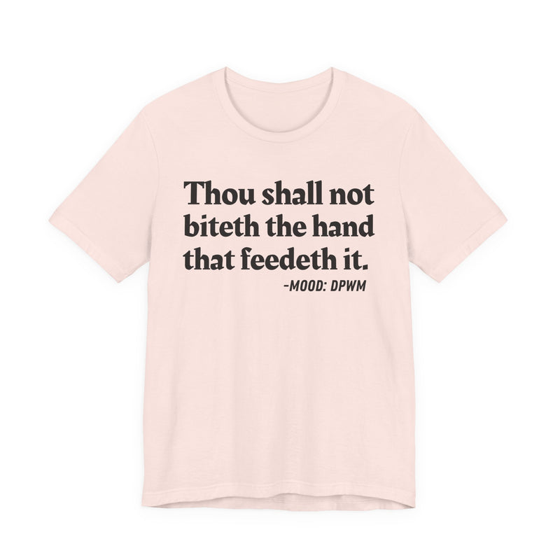 T-Shirt with text design reading “THOU SHALL NOT BITETH THE HAND THAT FEEDETH IT”, front view