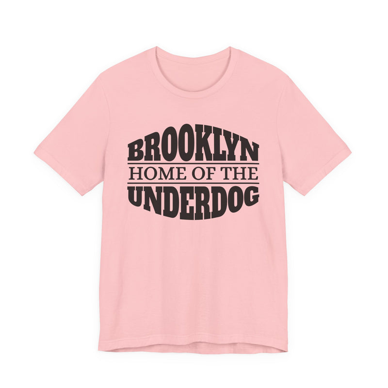 T-shirt with bold lettering reading BROOKLYN (HOME OF THE) UNDERDOG, product view.