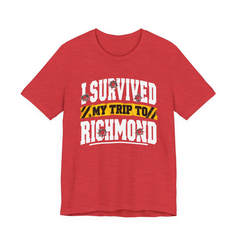 T-Shirt product photo with arched collegiate lettering reading "I SURVIVED" with bullet-hole decals, a caution-tape band reading "MY TRIP TO", and large block letters reading "RICHMOND", front view.
