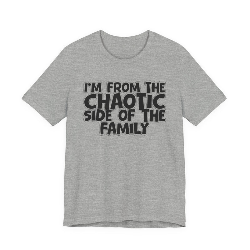 light t-shirt with ‘I’M FROM THE CHAOTIC SIDE OF THE FAMILY’ statement text in bold outline lettering, front flat-lay view.