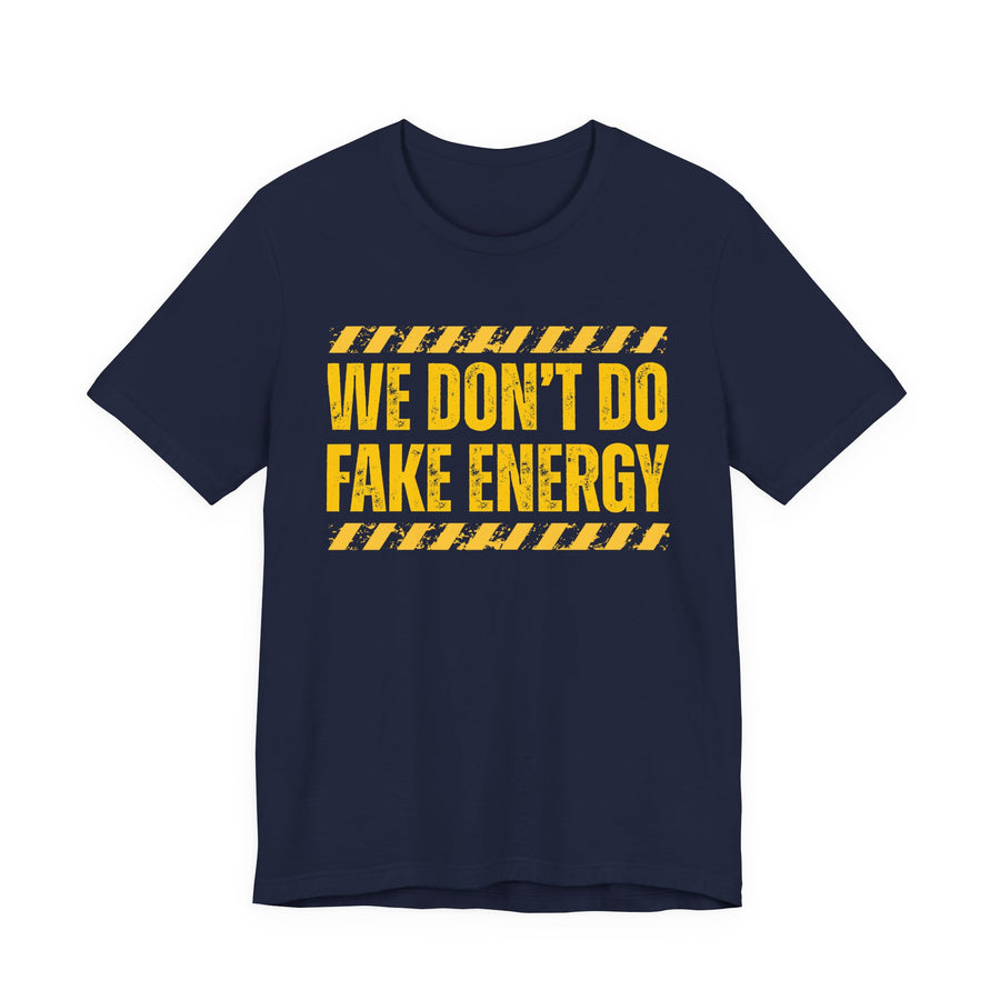 Navy t-shirt with gold distressed lettering reading "WE DON'T DO FAKE ENERGY", front flat-lay view.