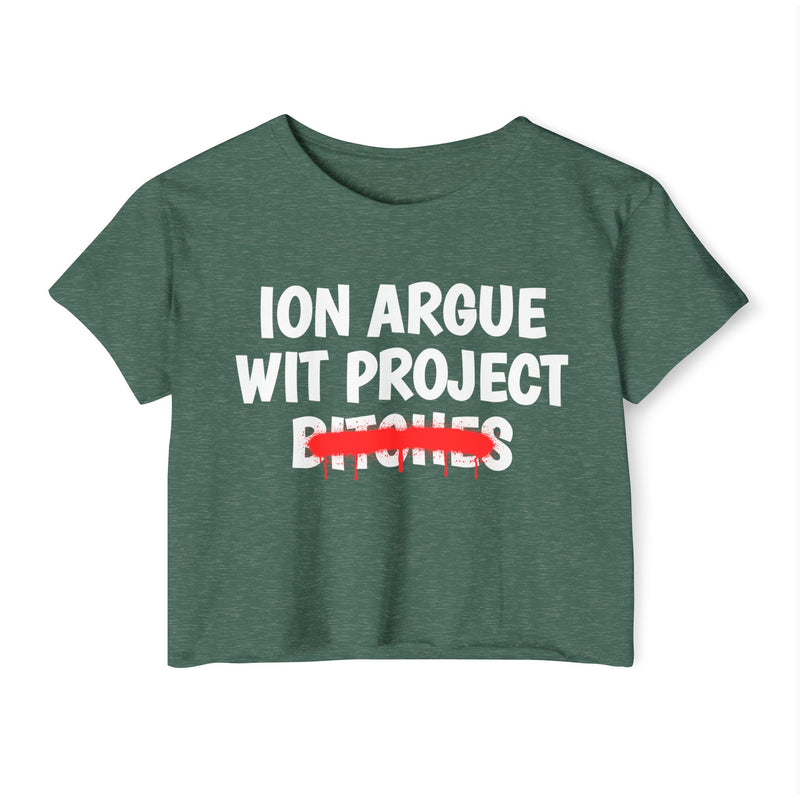 Royal Pine crop top with white stacked uppercase "ION ARGUE WIT PROJECT BITCHES" lettering, "BITCHES" crossed by a red spray-paint strike with drips, front flat-lay view.