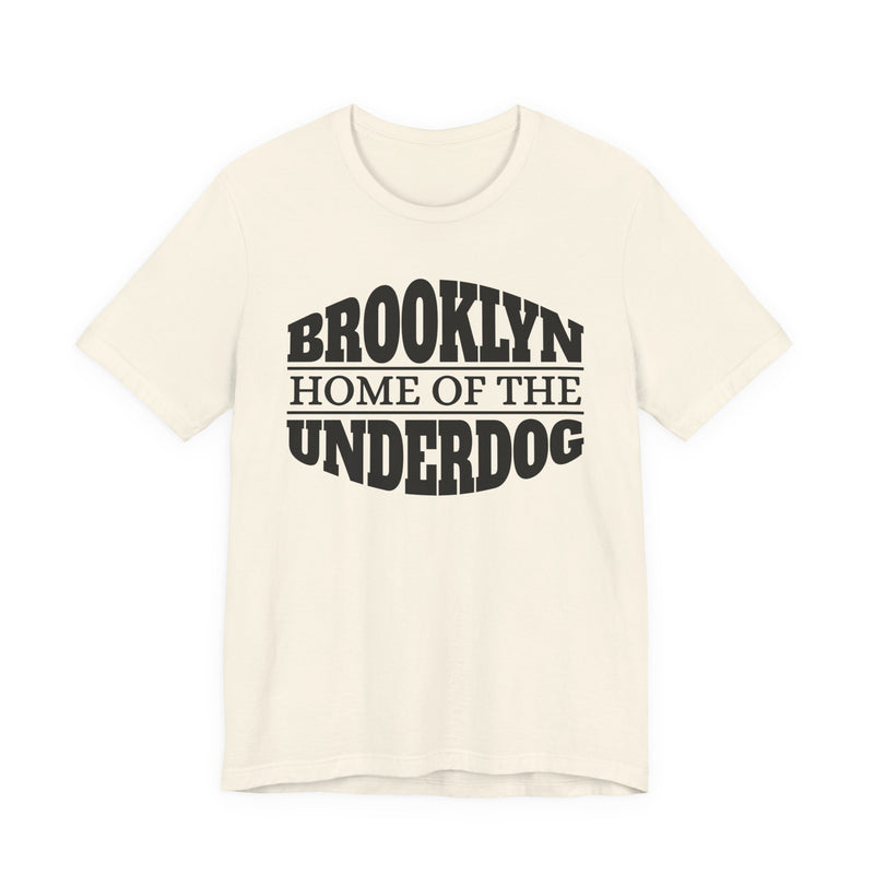 T-shirt with bold lettering reading BROOKLYN (HOME OF THE) UNDERDOG, product view.