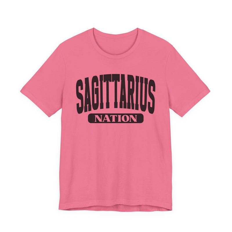 Pink t-shirt with black arched SAGITTARIUS collegiate lettering and NATION banner print, front flat-lay view.