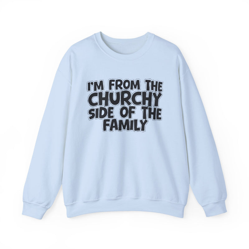Sand crewneck sweatshirt with black bubble lettering reading I'M FROM THE CHURCHY SIDE OF THE FAMILY, front flat-lay view.