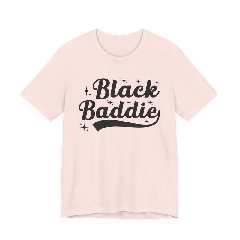 White t-shirt with dark bold statement lettering reading BLACK BADDIE, front flat-lay view.