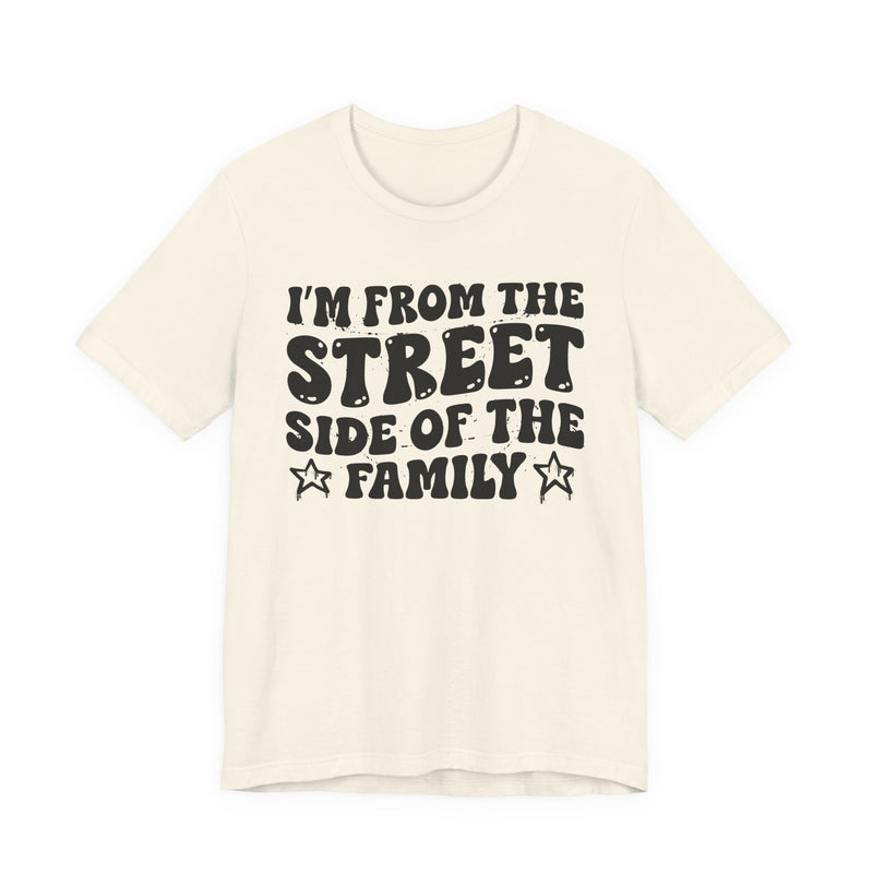 Natural t-shirt with white outlined bubble lettering reading 'I'M FROM THE STREET SIDE OF THE FAMILY', front flat-lay view.