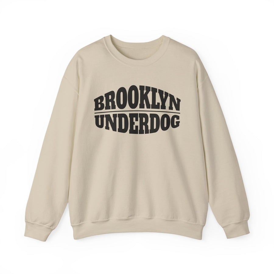 Sand sweatshirt with black arched BROOKLYN and inverted-arch UNDERDOG collegiate print, front flat-lay view
