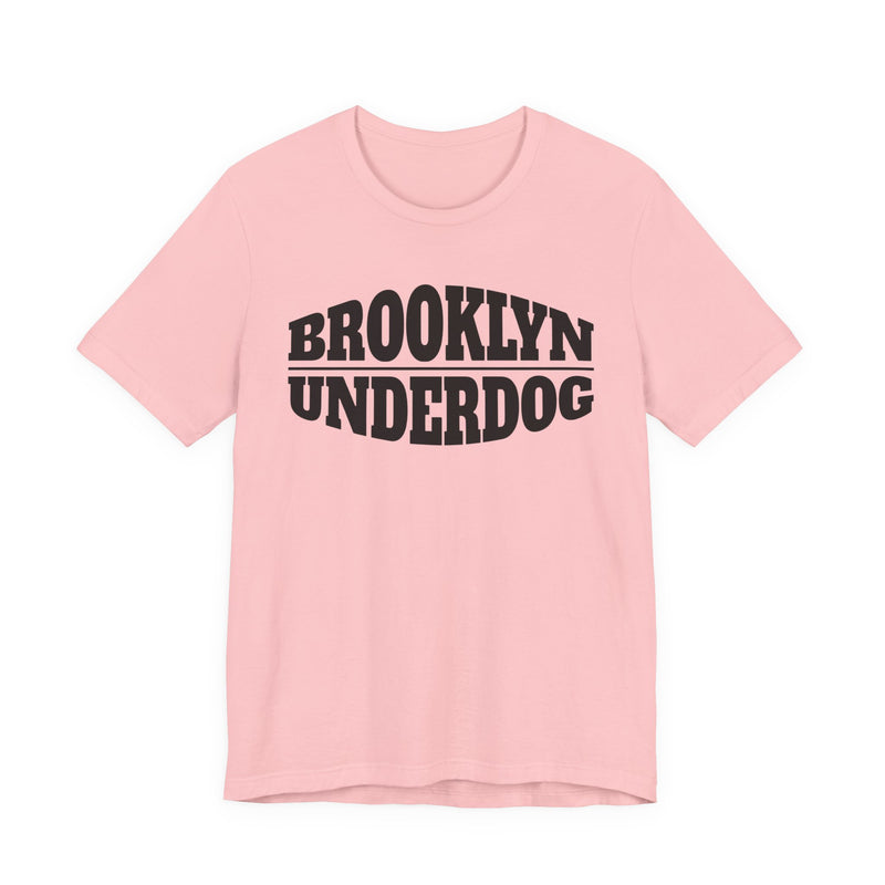 soft pink T-shirt with black arched BROOKLYN and inverted-arch UNDERDOG collegiate print, front flat-lay view