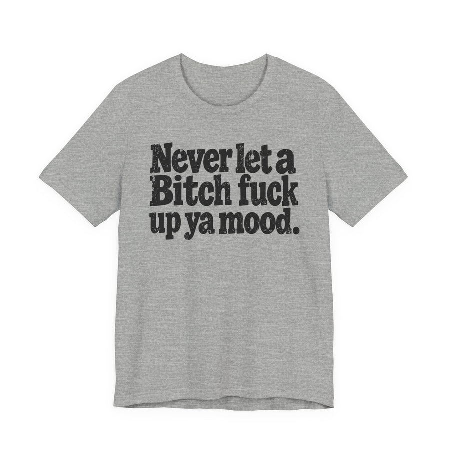 Athletic Heather tee with black and white western-style serif lettering reading "Never let a Bitch fuck up ya mood.", front flat-lay view.