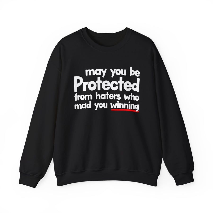 May You Be Protected From Haters Who Mad You Winning — Sweatshirt front view: MAY YOU BE PROTECTED FROM HATERS WHO MAD YOU WINNING in bold statement lettering. Street Talk Designs protection statement apparel.