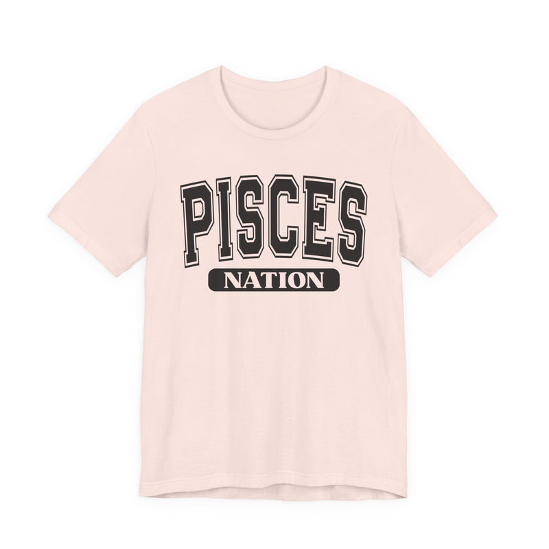 Soft pink T-shirt with black arched collegiate PISCES lettering and boxed NATION print, front view.