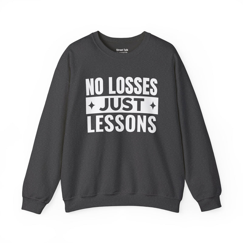 White sweatshirt with black block lettering reading NO LOSSES JUST LESSONS, alternate view.